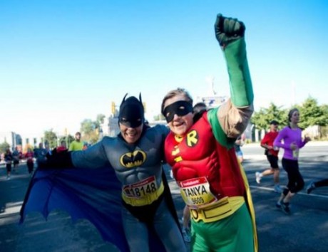 Batman and Robin raising money for the House at the 2013 Scotiabank marathon