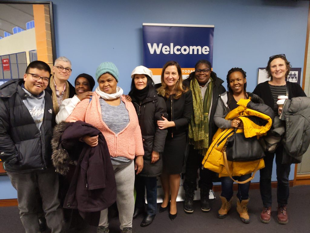 Adult learners with the deputy mayor at a community meeting