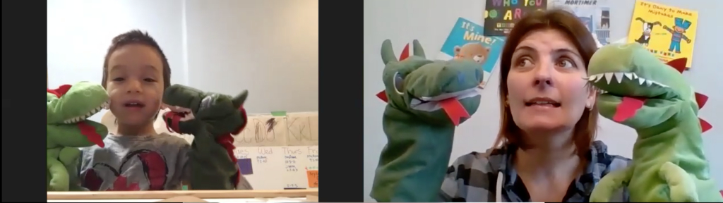 preschool program worker Sonia is on zoom with a young boy. they're both playing with the same dinosaur puppets