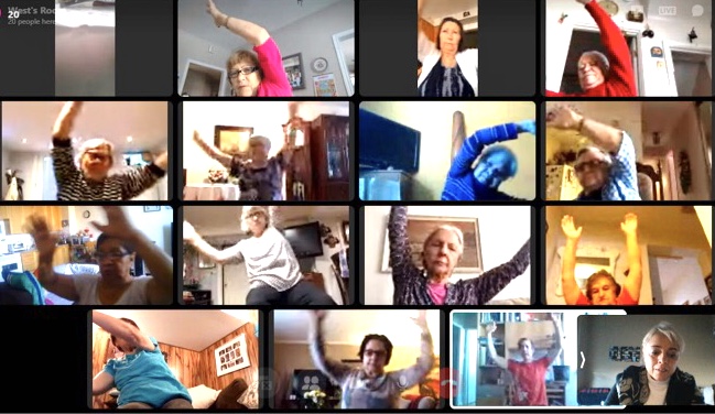 A group of older adults take a yoga class online during the COVID-19 pandemic